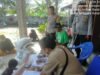 Polsek Kuripan Amankan Penyaluran Beras Kementerian Ketahanan Pangan RI di Desa Kuripan Timur
